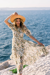 a lady in an off the shoulder floral print dress